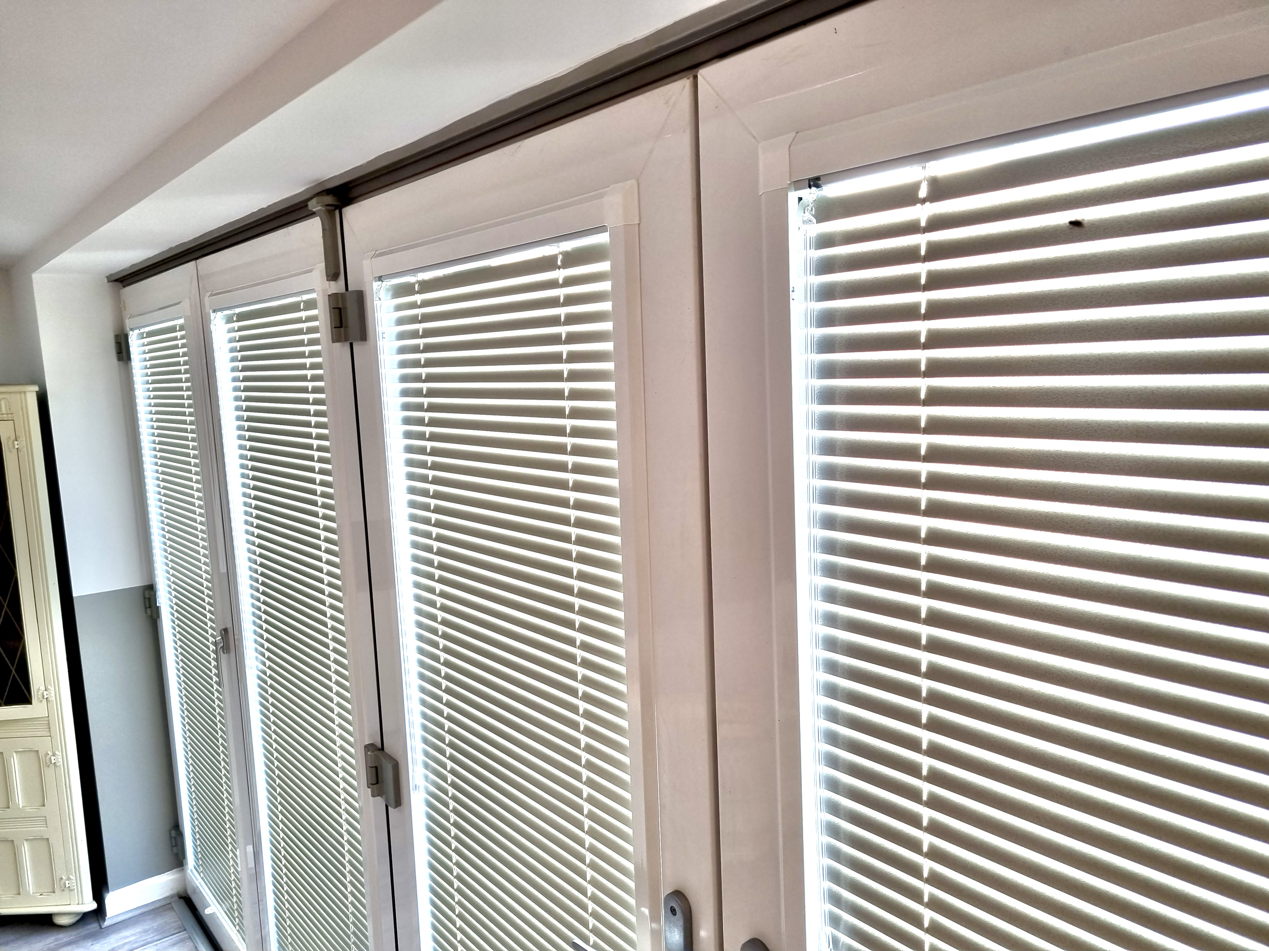 Perfect Fit blinds fitted to bi-fold doors, no drilling into the frame